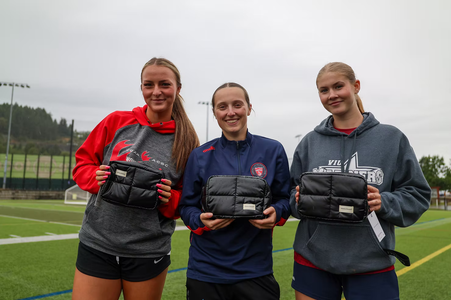 NUFC Athletes holding Athleticus Research Leakproof Kits.